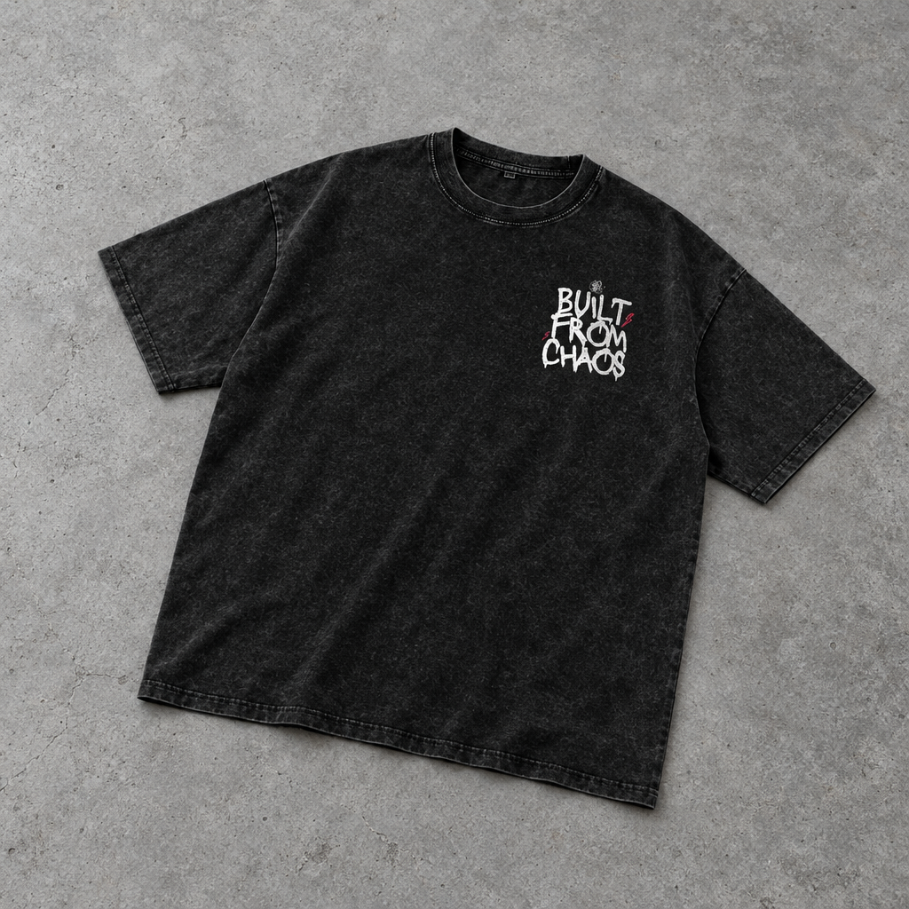 Built From Chaos oversized tee – washed black oversized tee with small chest print, flat lay, AI-generated mockup