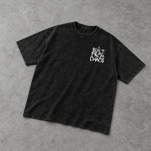 Built From Chaos oversized tee – washed black oversized tee with small chest print, flat lay, AI-generated mockup