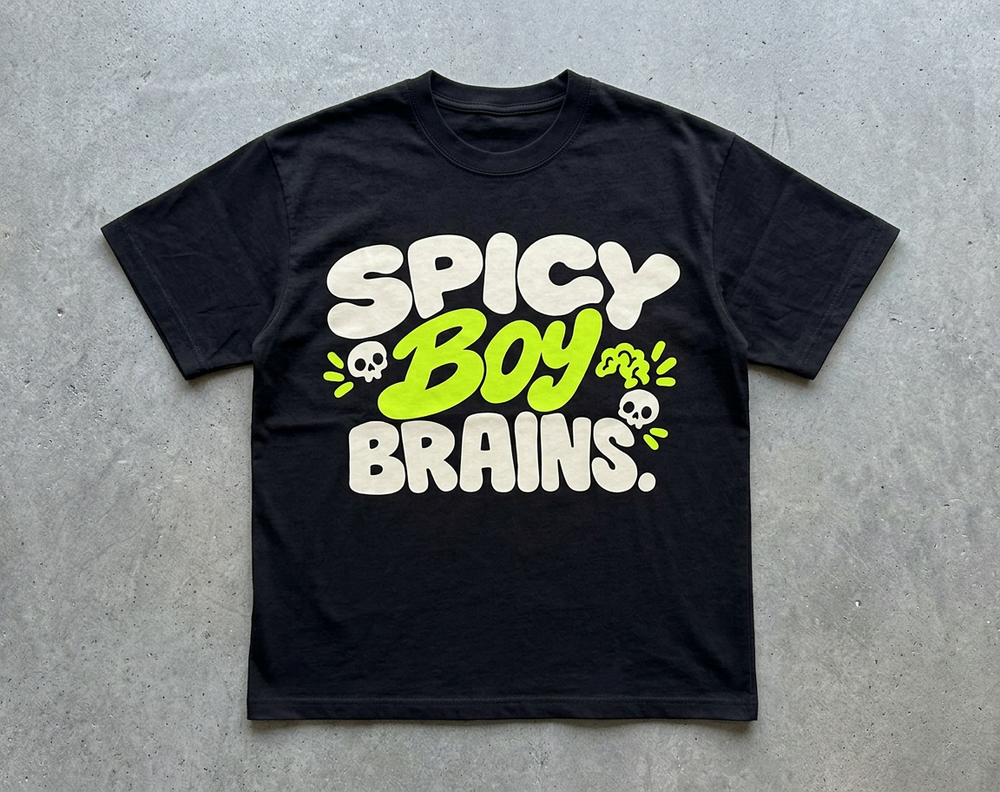 Spicy Boy Brains tee – black tee with cream and lime Spicy Boy Brains print, flat lay, AI-generated mockup