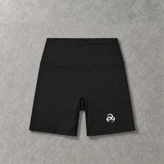 Oddens Core biker shorts – black high-waisted biker shorts with small logo, flat lay, AI-generated mockup