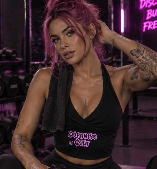 Dopamine Cult halter crop top – woman wearing the black halter top with pink Dopamine Cult print in a neon-lit gym, AI-generated mockup