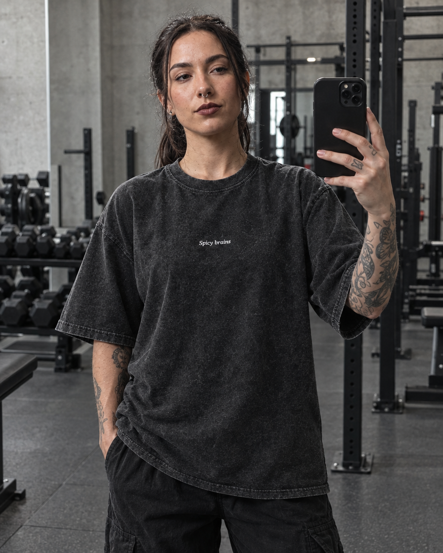 Stay Weird Spicy Brains oversized tee – woman wearing the tee, mirror selfie, AI-generated mockup