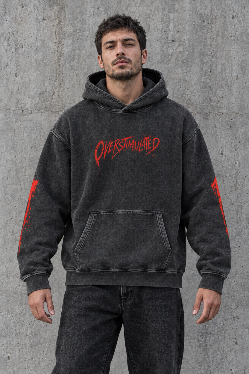 Overstimulated horror hoodie – man wearing the black hoodie, front view, AI-generated mockup