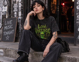 Low Voltage washed oversized tee – woman wearing the tee in a bar, AI-generated mockup