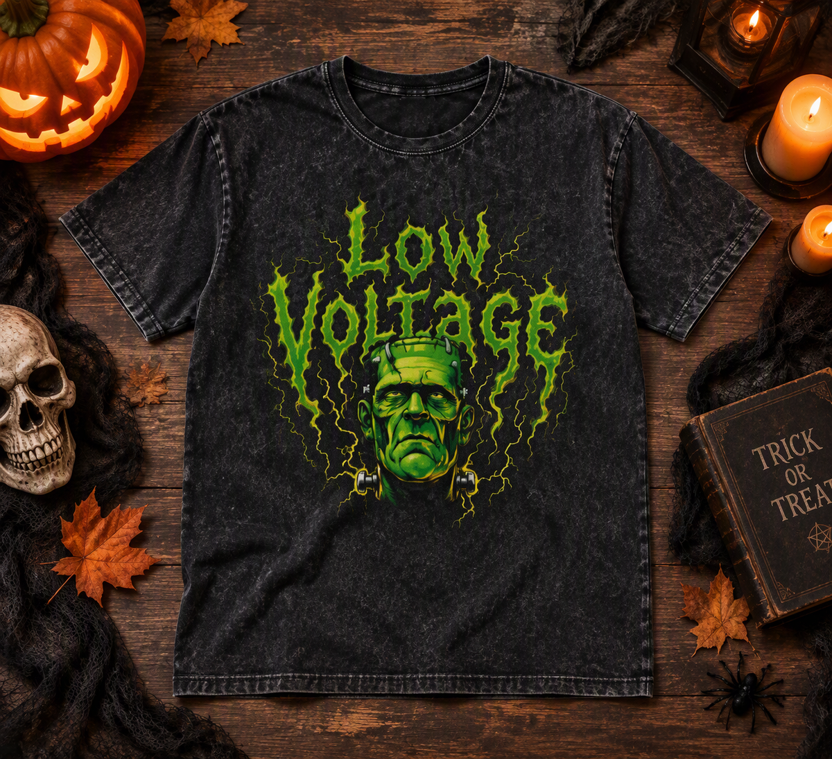 Low Voltage washed oversized tee – washed black tee with slime-green Low Voltage monster print, flat lay, AI-generated mockup