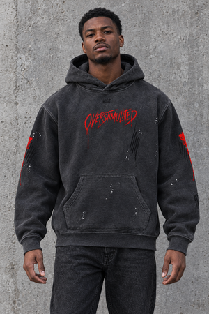 Overstimulated distressed horror hoodie – man wearing the distressed hoodie, front view, AI-generated mockup