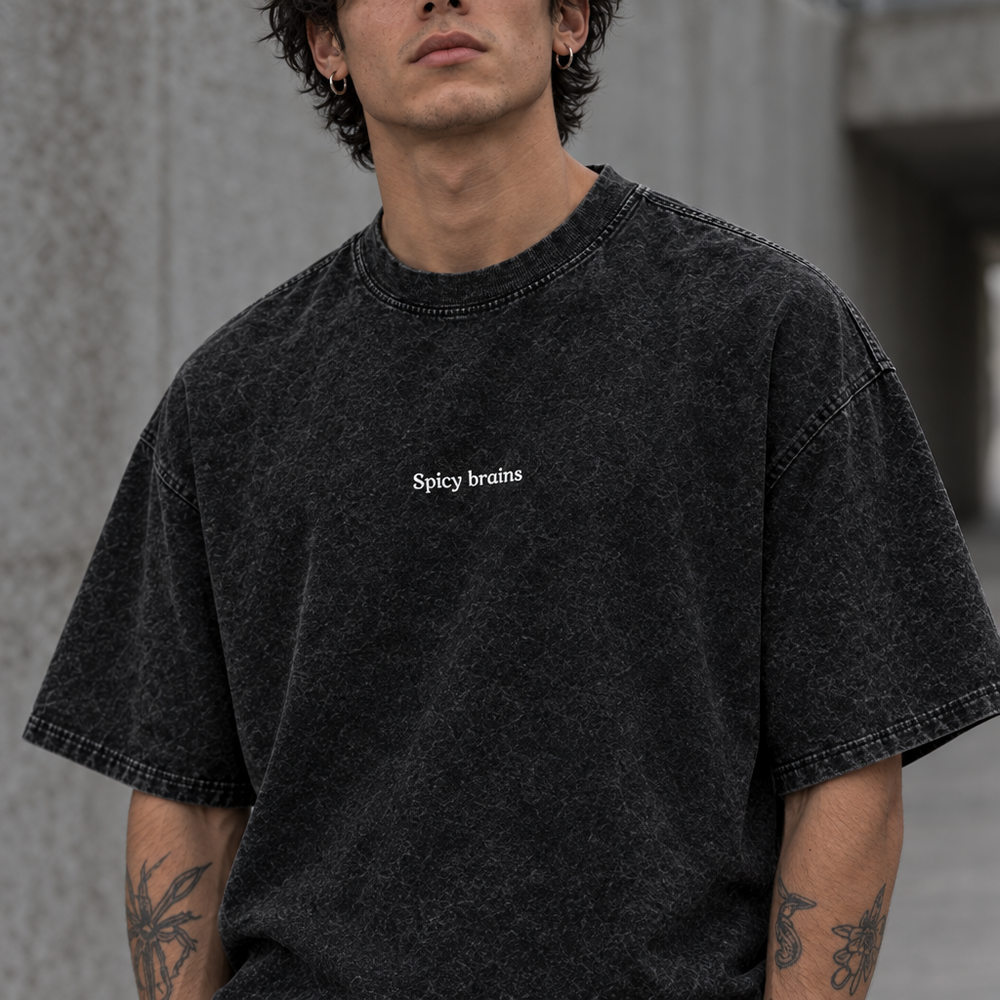 Stay Weird Spicy Brains oversized tee – man wearing the tee, close front view, AI-generated mockup