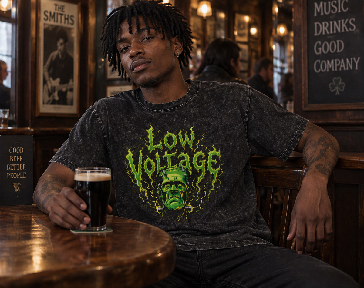 Low Voltage washed oversized tee – man wearing the tee in a bar, AI-generated mockup